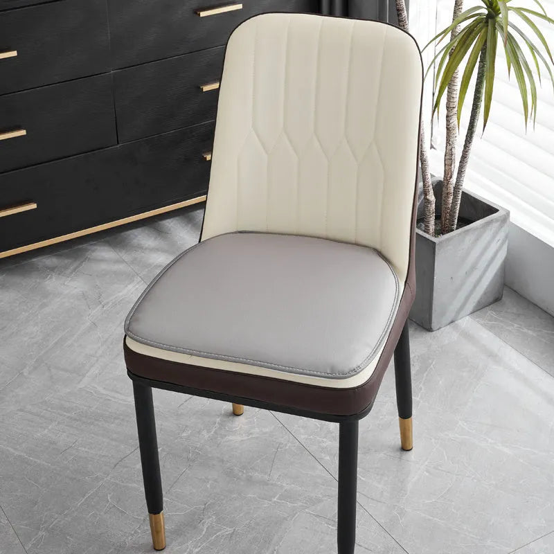 Leather horseshoe-shaped seat cushion in beige colour showing curved back support design