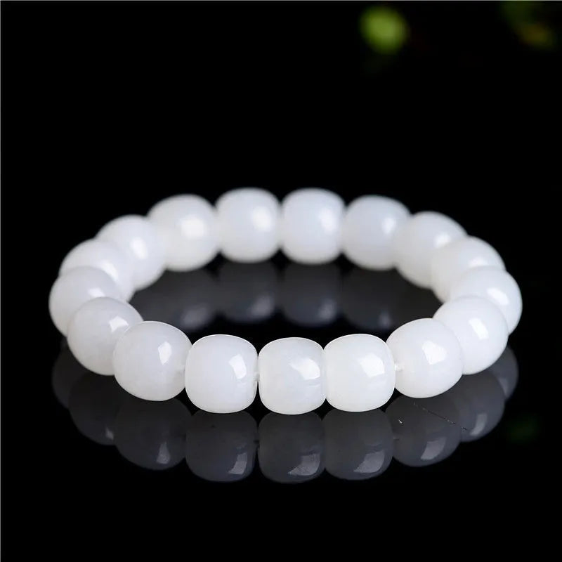 White Hetian jade barrel bead bracelet on a wrist, showing three bead size options for men and women.