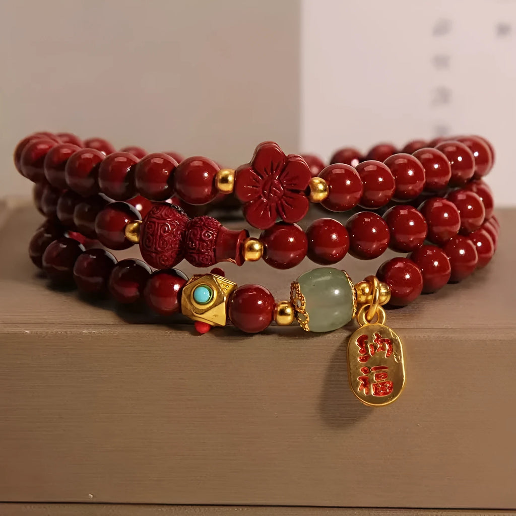 Polished cinnabar gourd five petal flower bracelet 6mm multi-circle on display