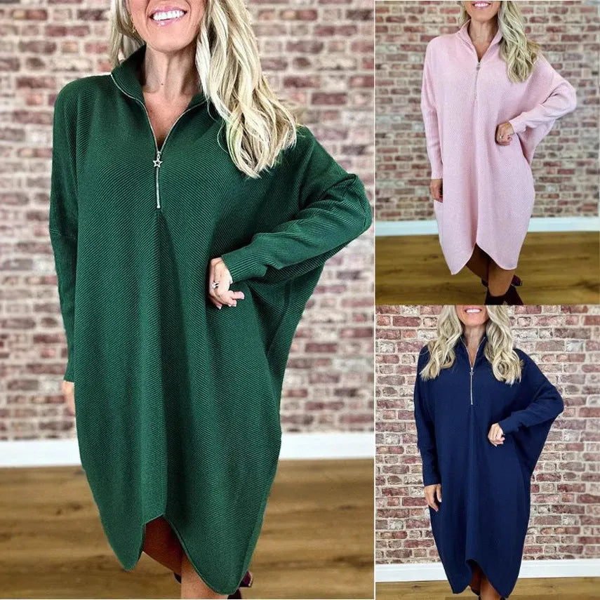 Women's solid colour loose knitted dress with a zipper detail on a hanger.
