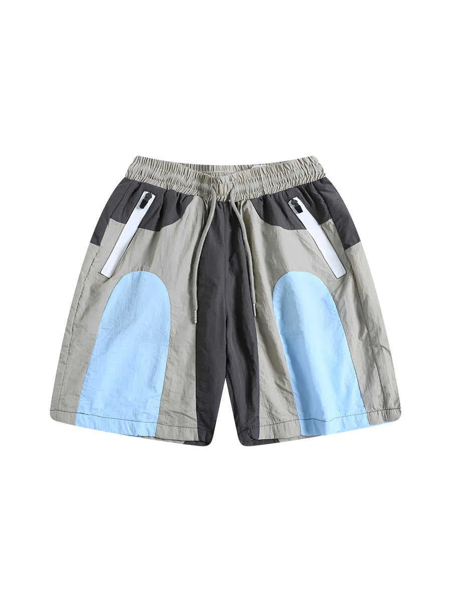Blue patchwork quick-drying shorts with loose straight-leg styling and micro-elastic waistband