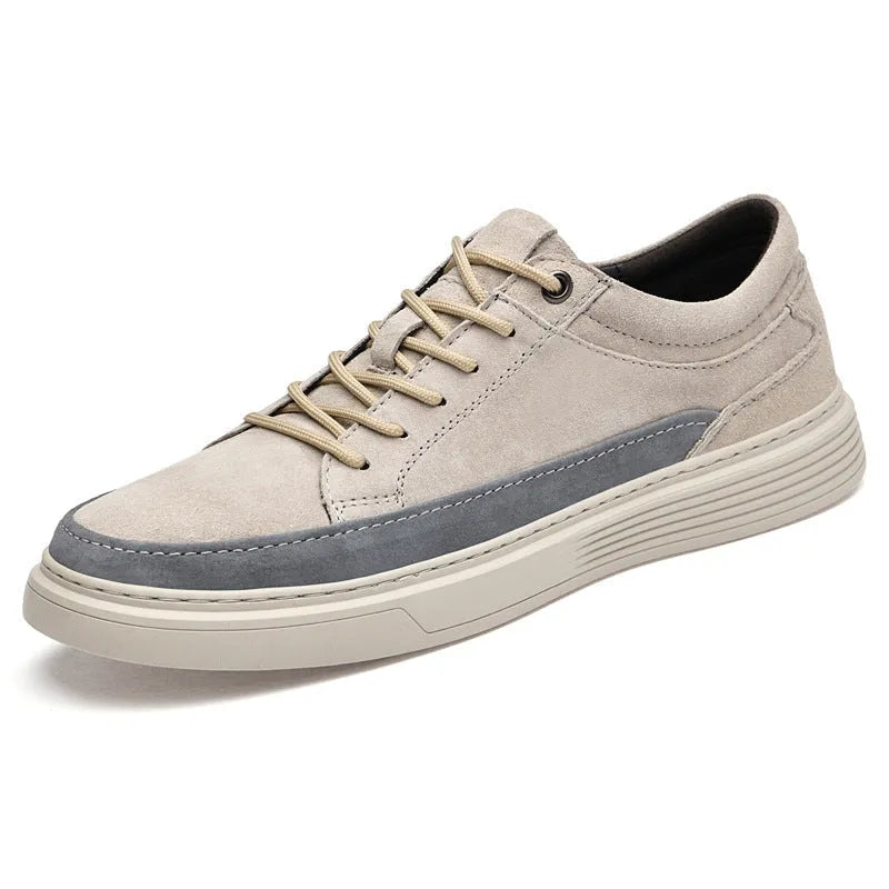 Men's grey casual leather skate shoes with lace-up front and rubber sole