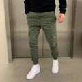 Men's light blue loose-fit casual trousers with patch pockets and an elasticated lace waistband.
