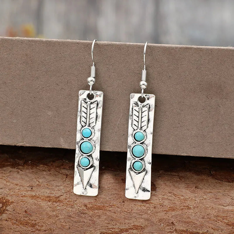 Silver geometric long drop earrings with turquoise inlay on a retro-style zinc alloy setting.