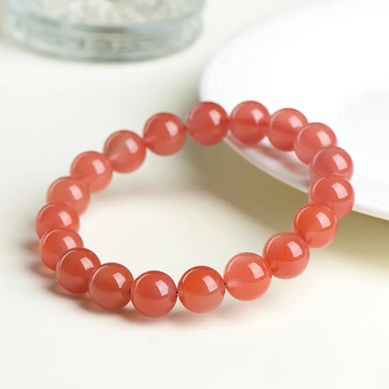 Natural cherry red agate scattered bead bracelet with polished stones.