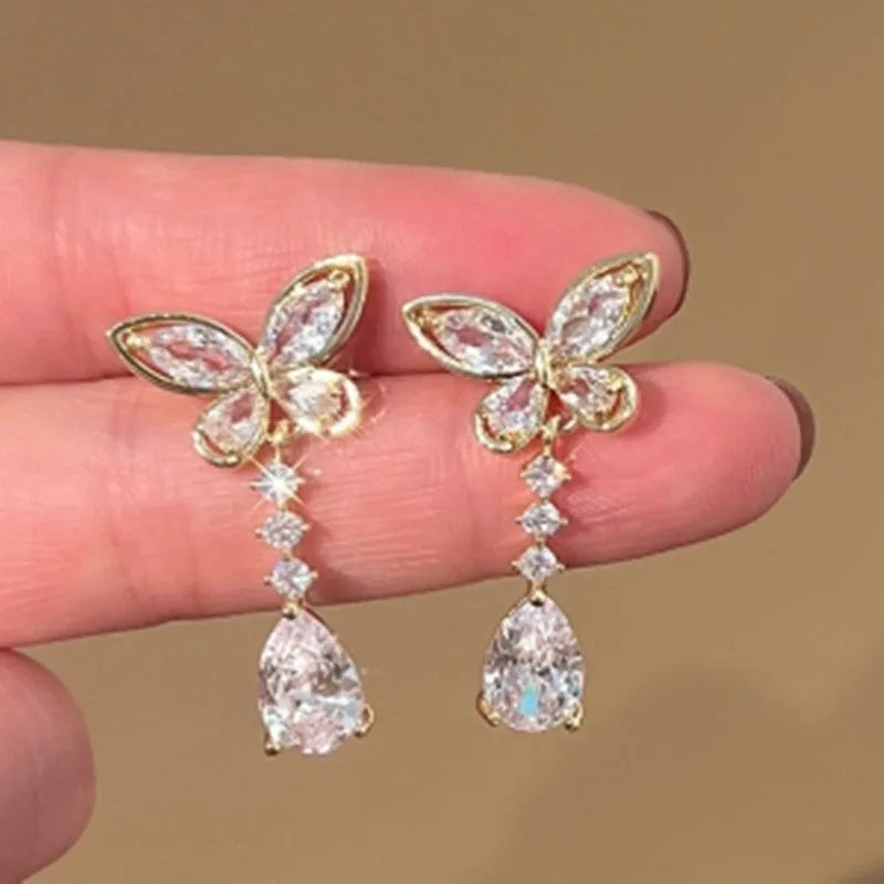 Platinum-coloured bow stud earrings made from zinc alloy with electroplated finish