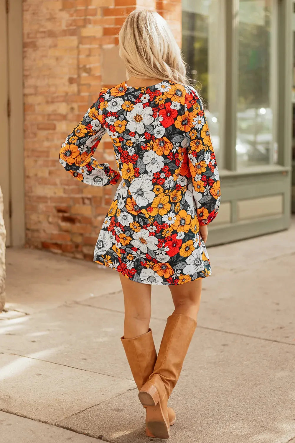 Orange floral print women's dress with striped lace sleeves and hem, V-neck long sleeve design.