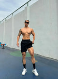 Men's quick-drying nylon shorts in quarter-length design with double-layer construction