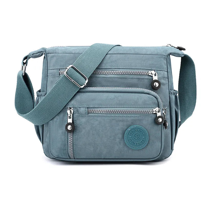 Nylon messenger bag with square vertical shape in one of five colour options