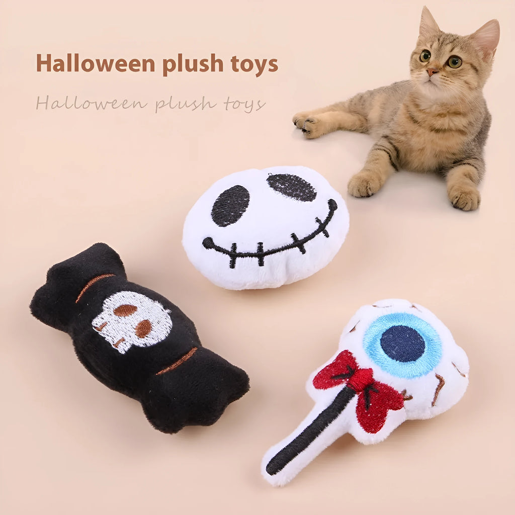 Small plush cat teaser wand with replaceable candy and skull head designs for interactive feline play