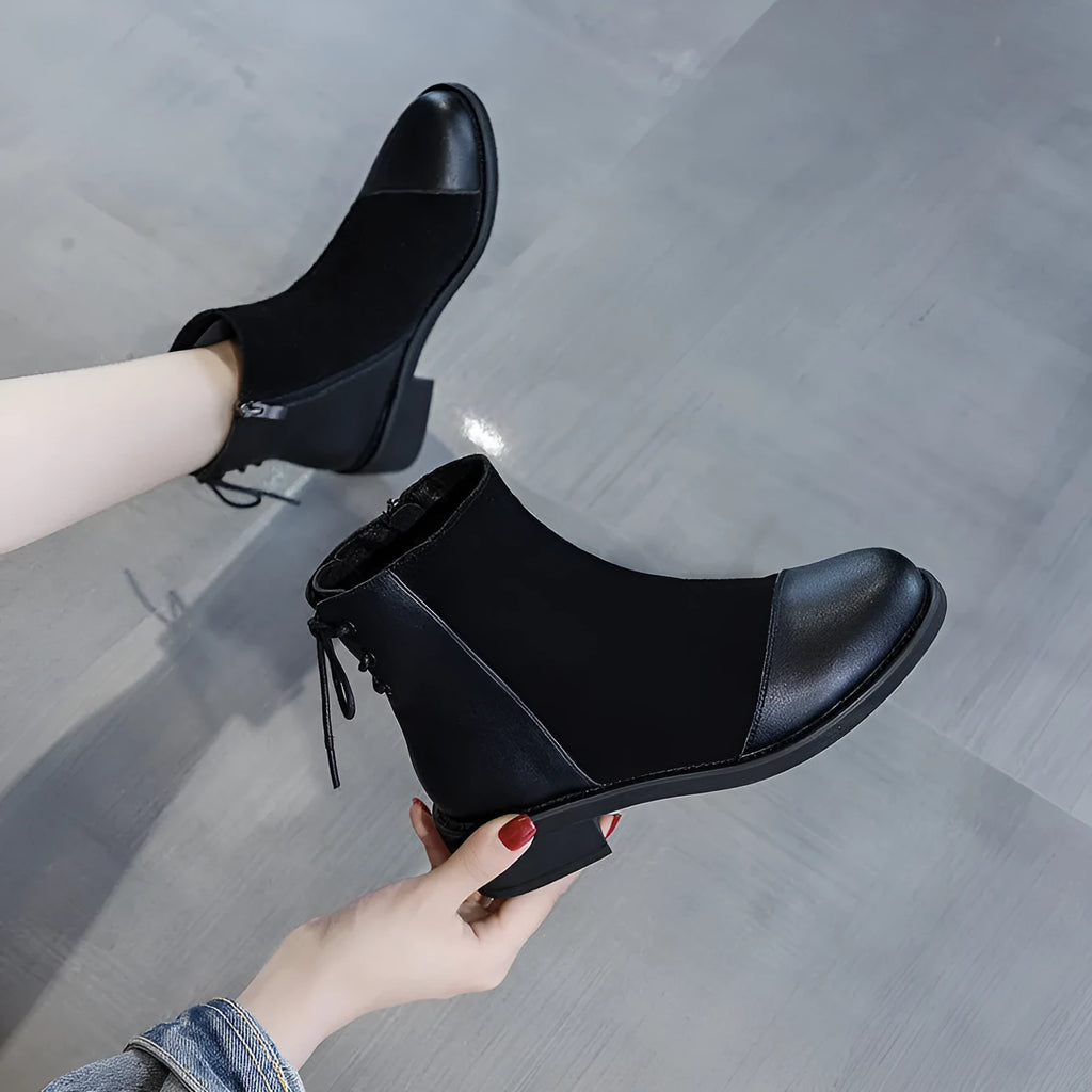Black women's Martin boots with side zip, round toe, and short stout heel