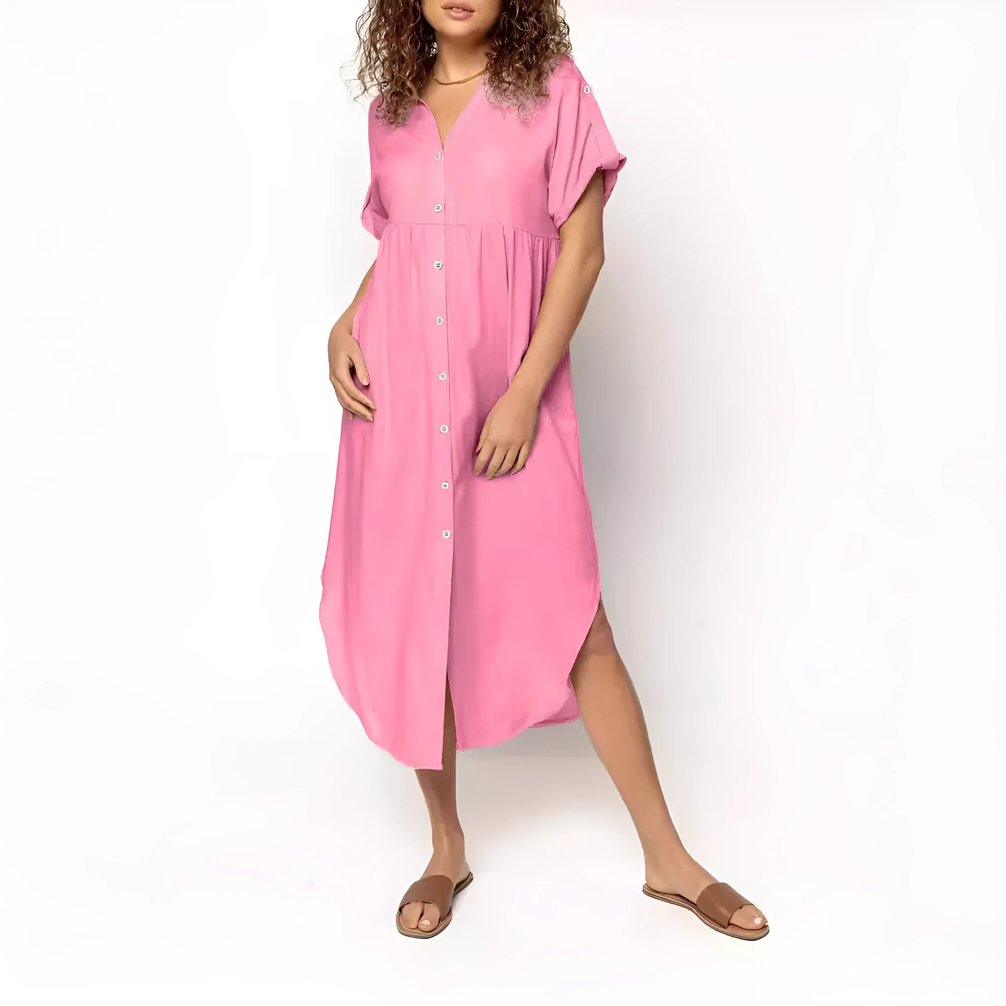 A loose-fitting, solid-colour button-down midi dress on a hanger, shown in apricot colour.