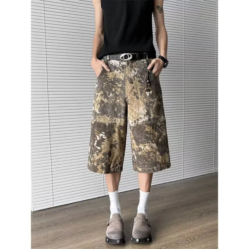 Yellow jeans with snake pattern camouflage design in cropped length