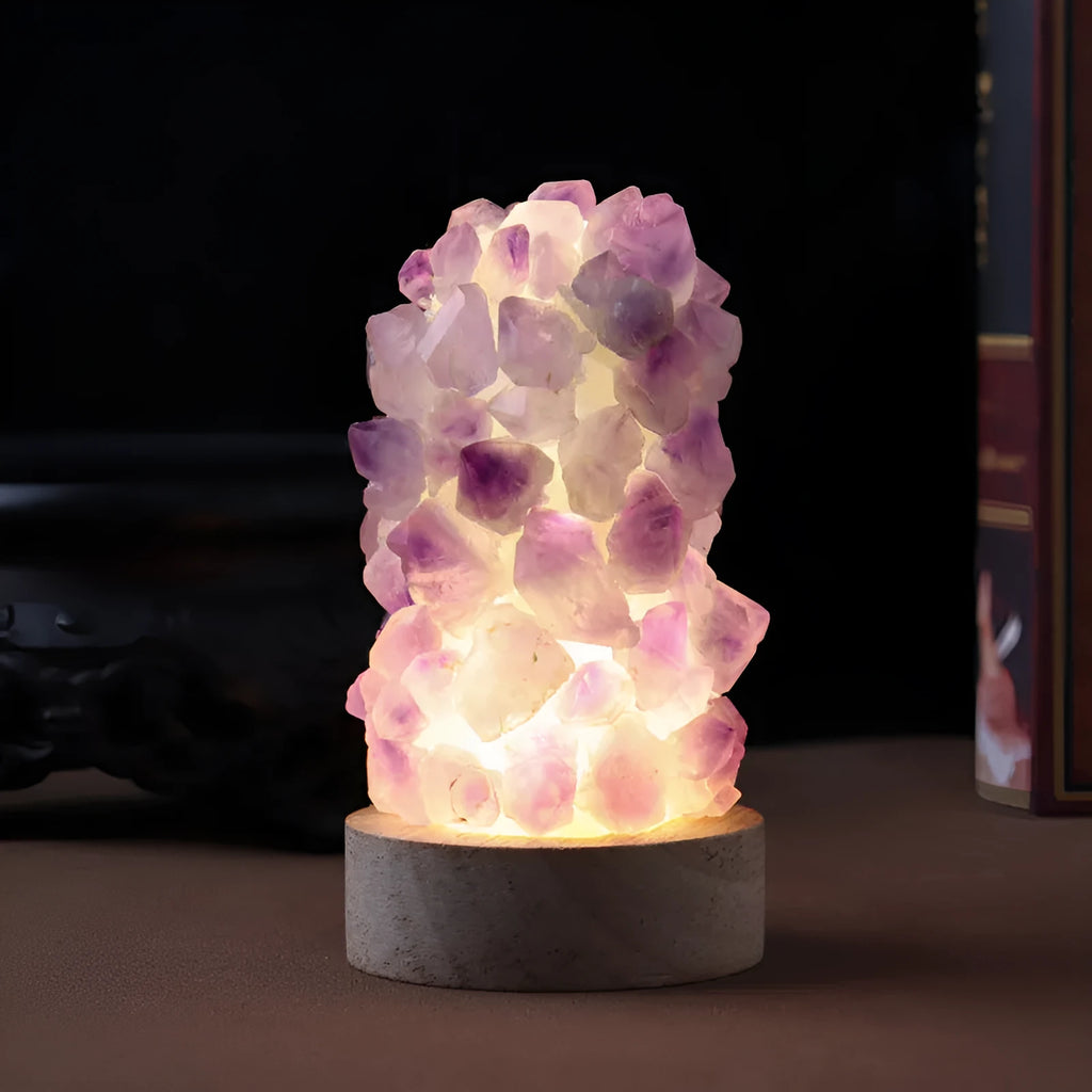 Natural amethyst vug tooth flower mini night light USB plug-in crystal lamp with warm light option on a wooden surface