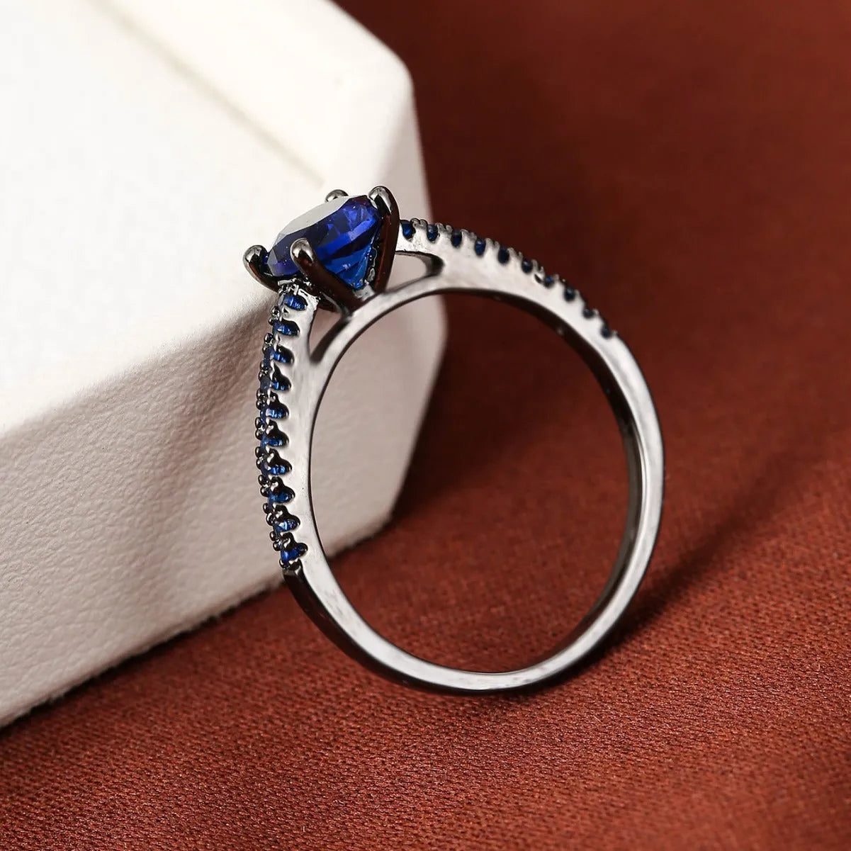 Copper hexagonal geometric ring with electroplated colour finish and CZ stone.