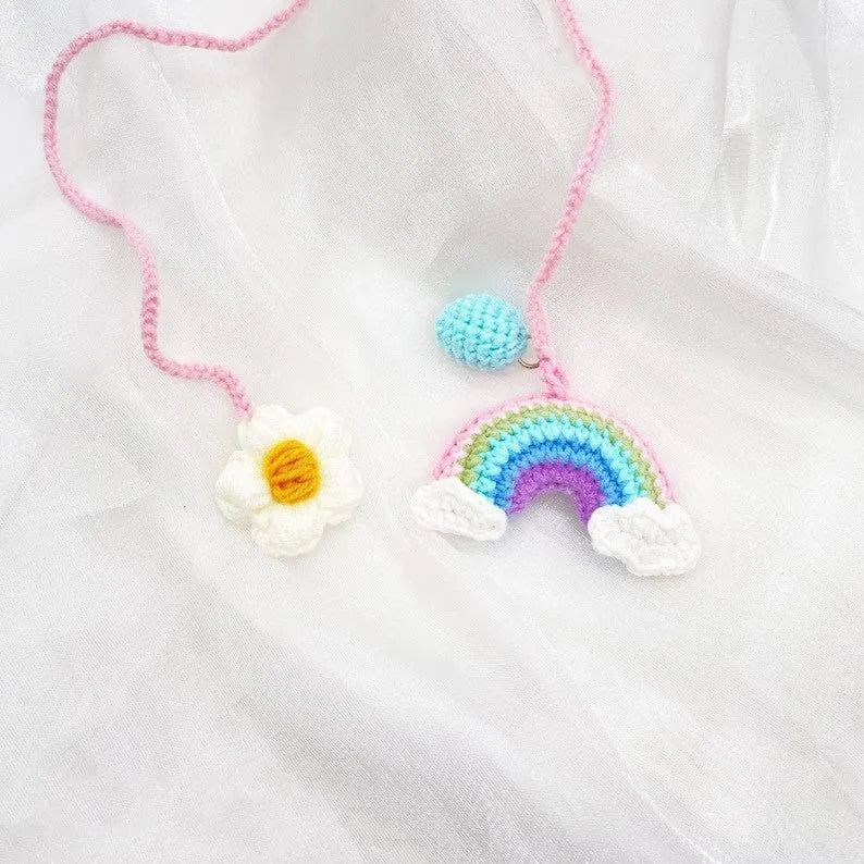 Handmade wool crocheted car pendant in avocado, pink rainbow, and red rainbow colour options