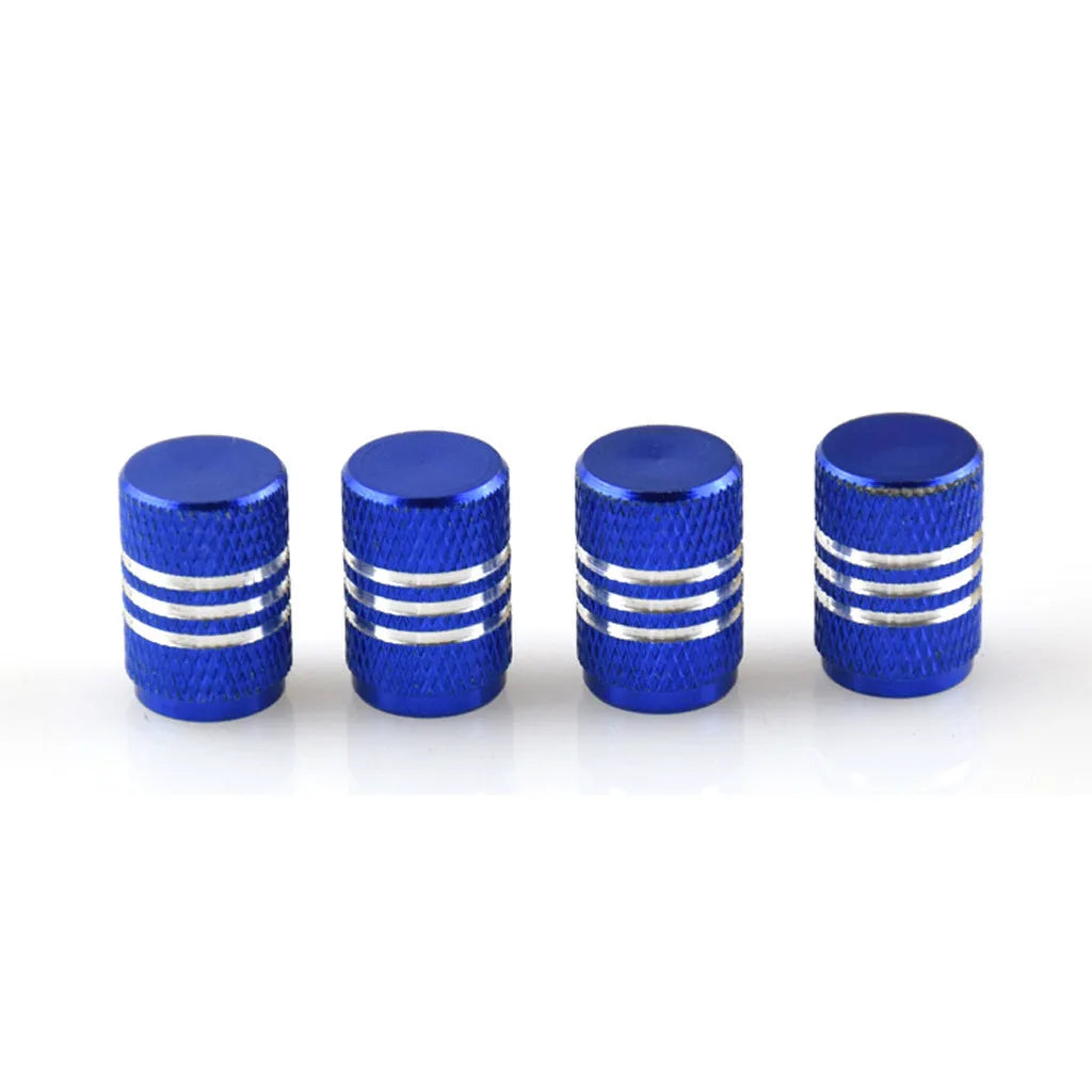 Set of coloured stainless steel car tyre valve caps in ten colours on a white background