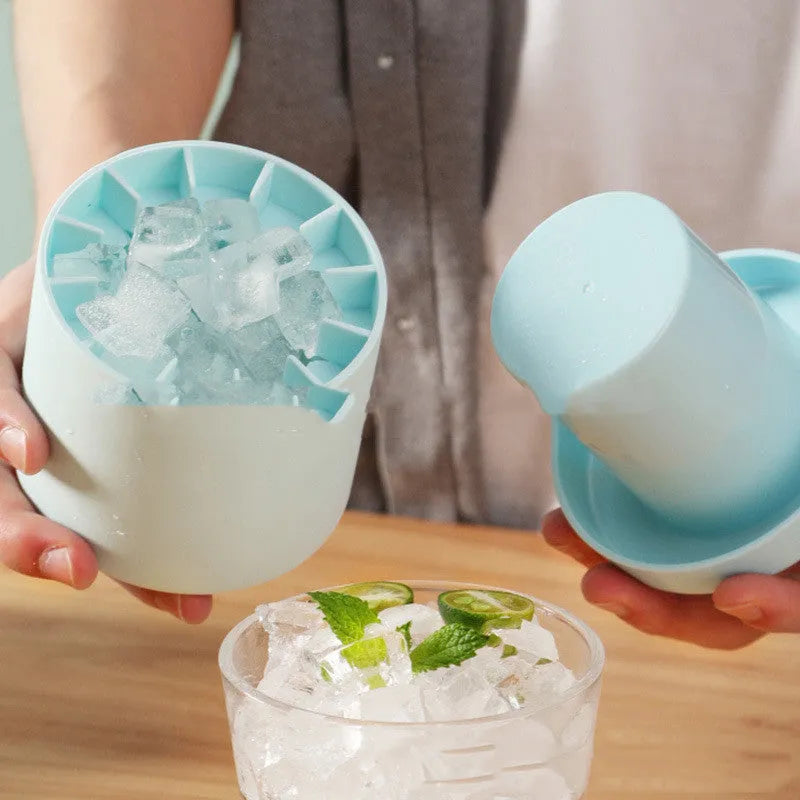 Portable 2-in-1 silicone ice bucket mold with lid in blue-green on a white background