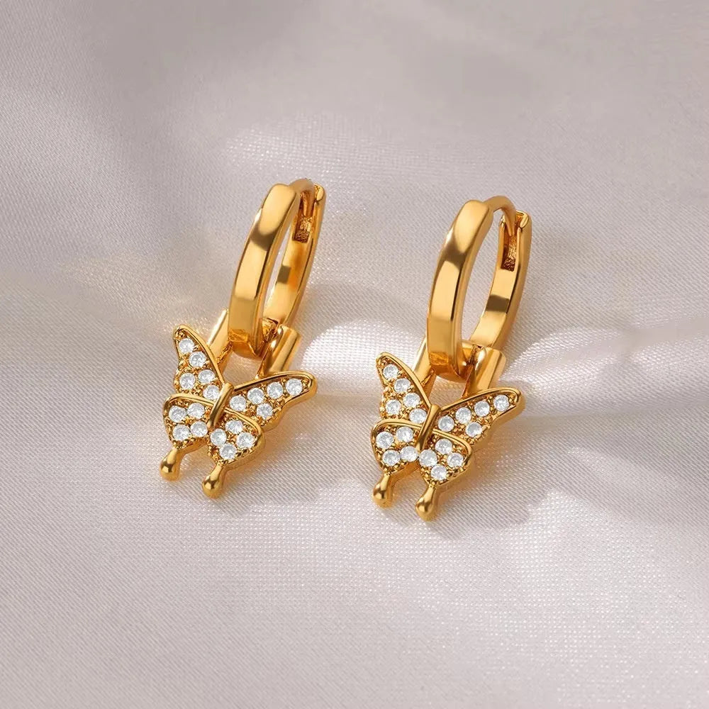 Copper butterfly earrings with irregular geometric design combining heart, bow and star shapes in diamond colour treatment