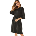 Black A-line dress with elastic waist, long sleeves with elastic cuffs and matching belt