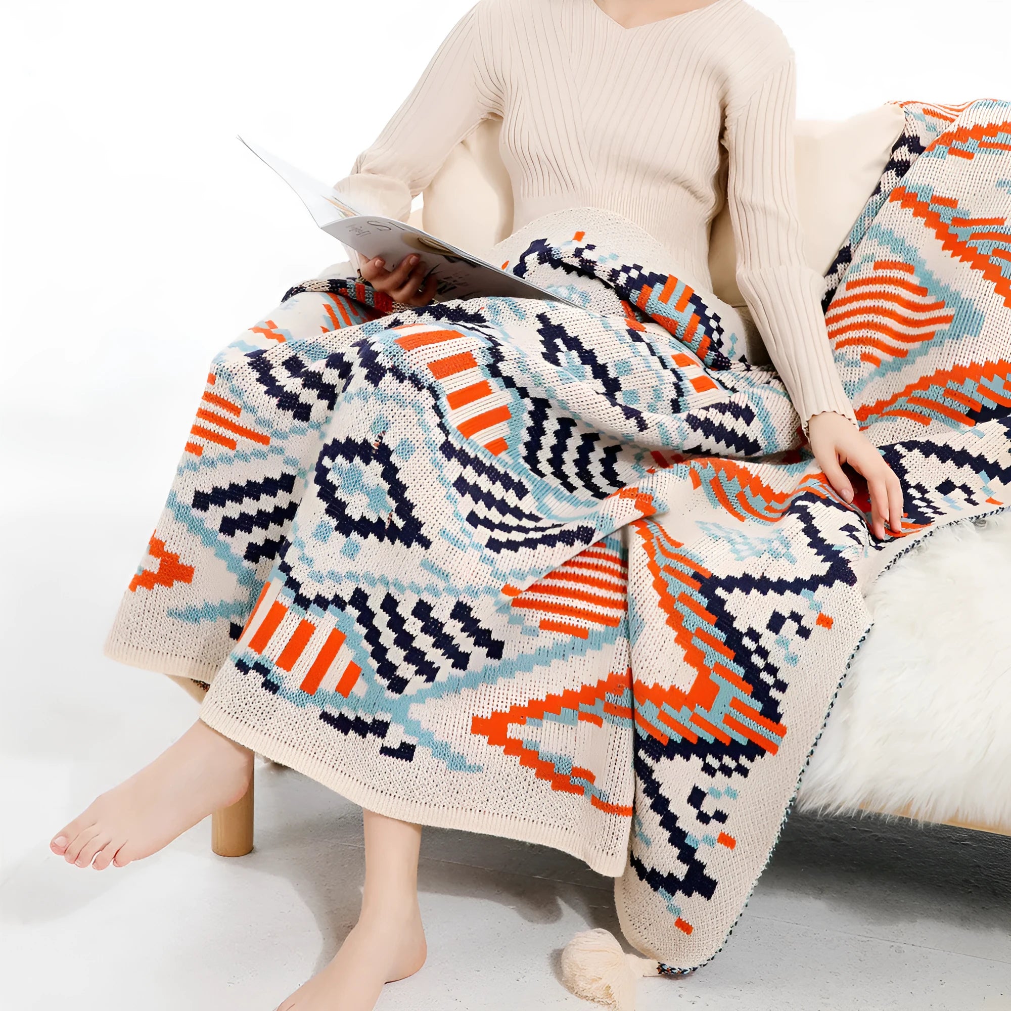 Bohemian style acrylic sofa throw blanket with tassel trim in a geometric pattern colour