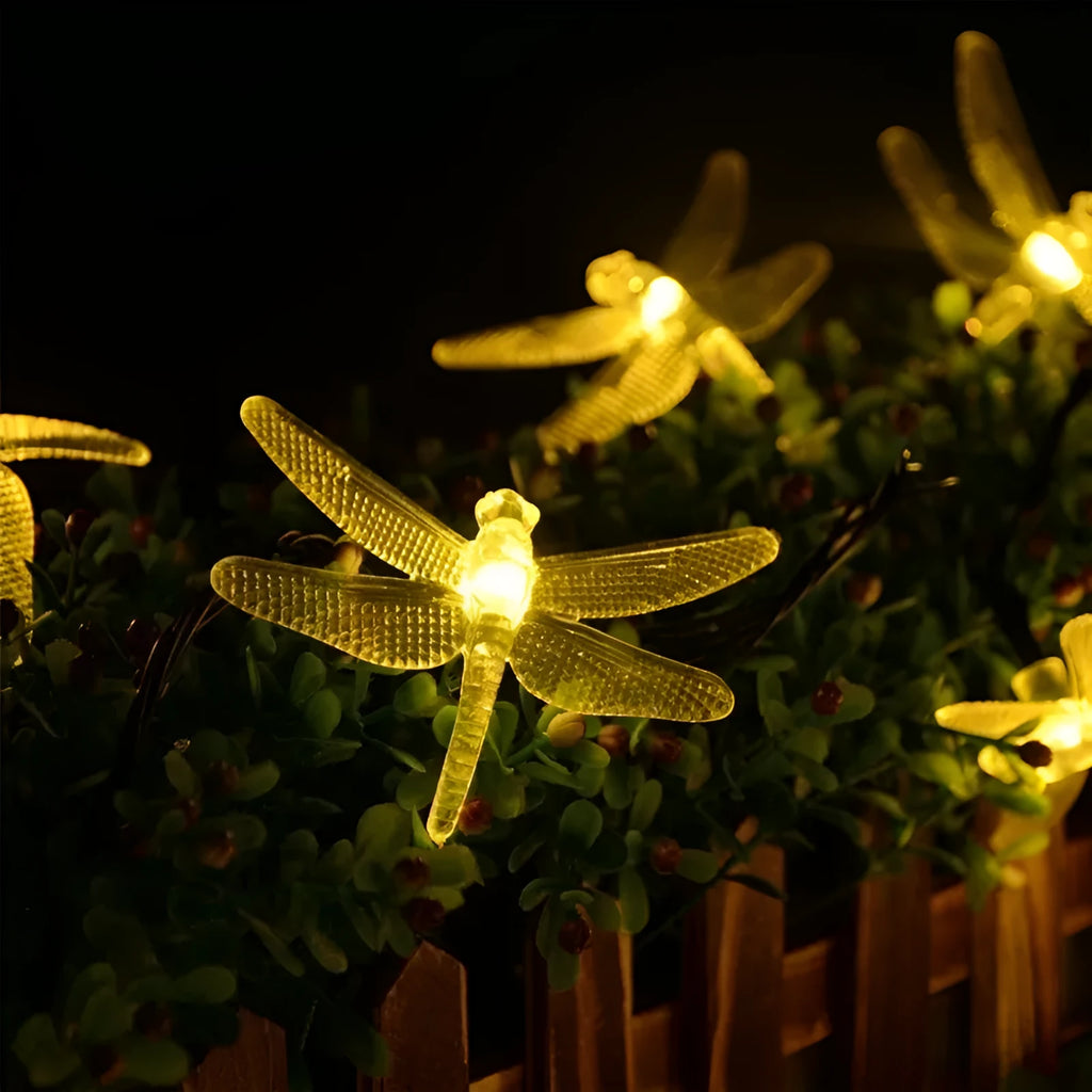 Outdoor solar LED string light with 30 warm white LEDs on 6-metre cable, solar panel with ground spike, and IP65 waterproof rating