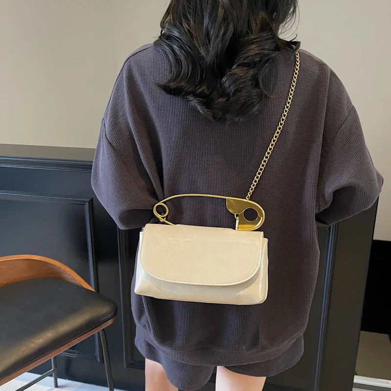 Creative paper clip shoulder handbag in PU leather with sewing thread detail, horizontal square shape