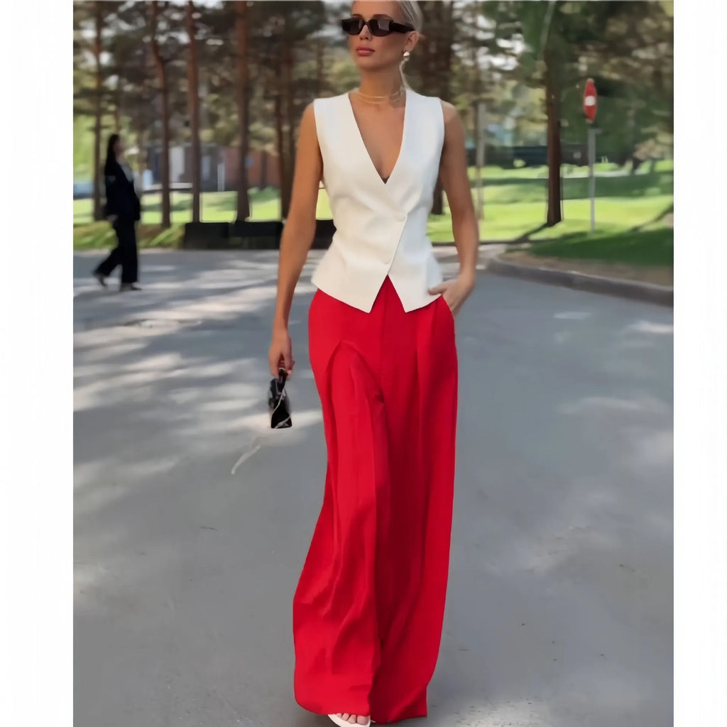 Women's beige deep V-neck sleeveless top and high waist wide leg pants two-piece set on model