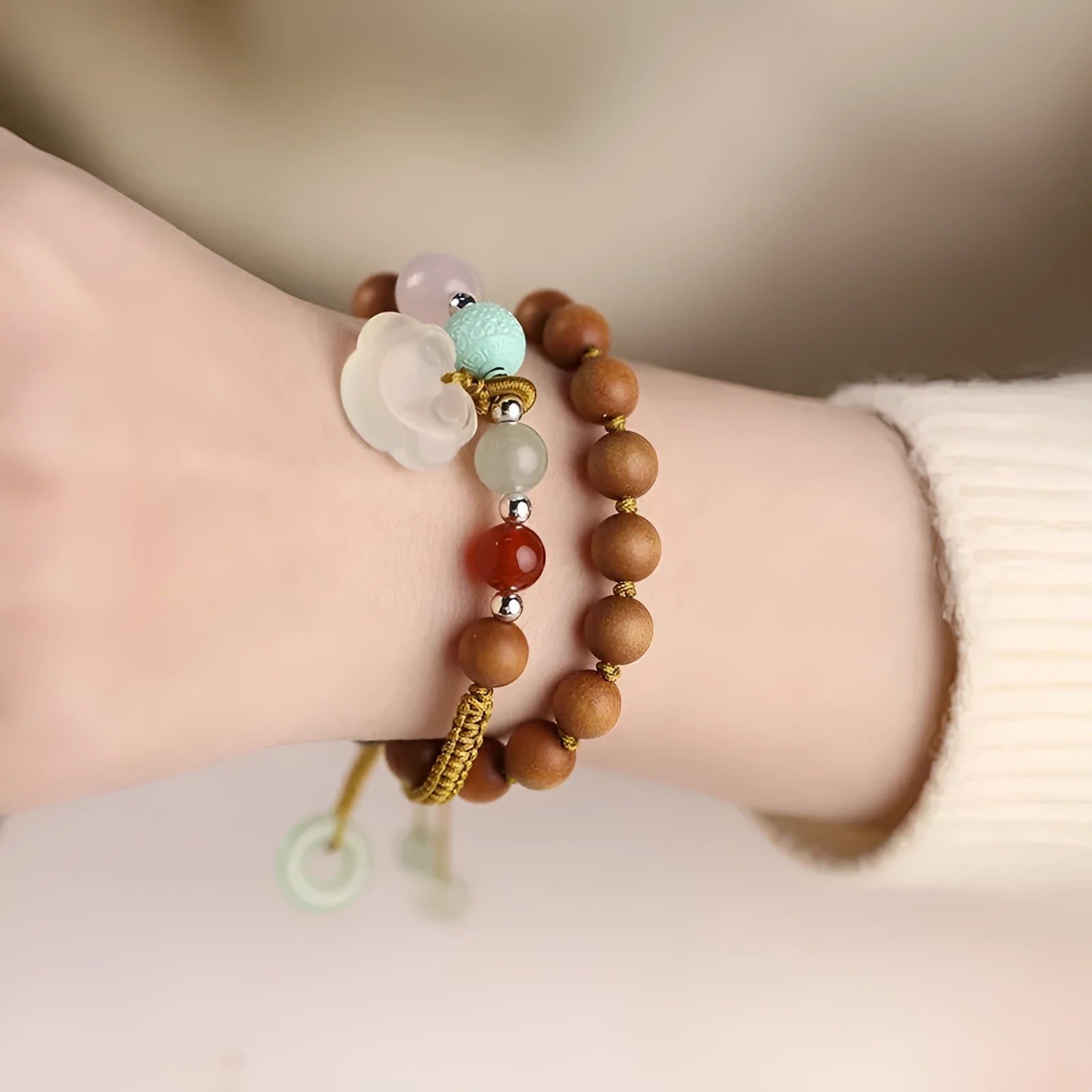 Women's ebony hand-woven double ring bracelet with Ruyi motif, available in Xiuyan jade colour