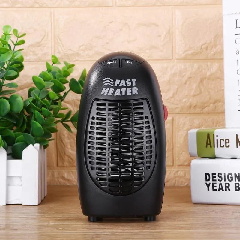 Black portable electric ceramic heater with digital display and rotating plug on a table