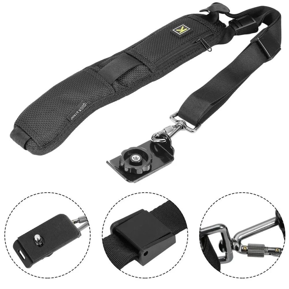 Black nylon DSLR sling strap with metal buckle and screw plate on table