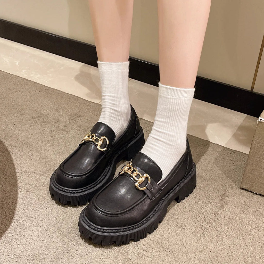 British retro round toe flat heel shoes for women in black glossy finish showing side view