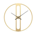Round metal wall clock with 50 cm diameter in black or gold finish on a plain wall