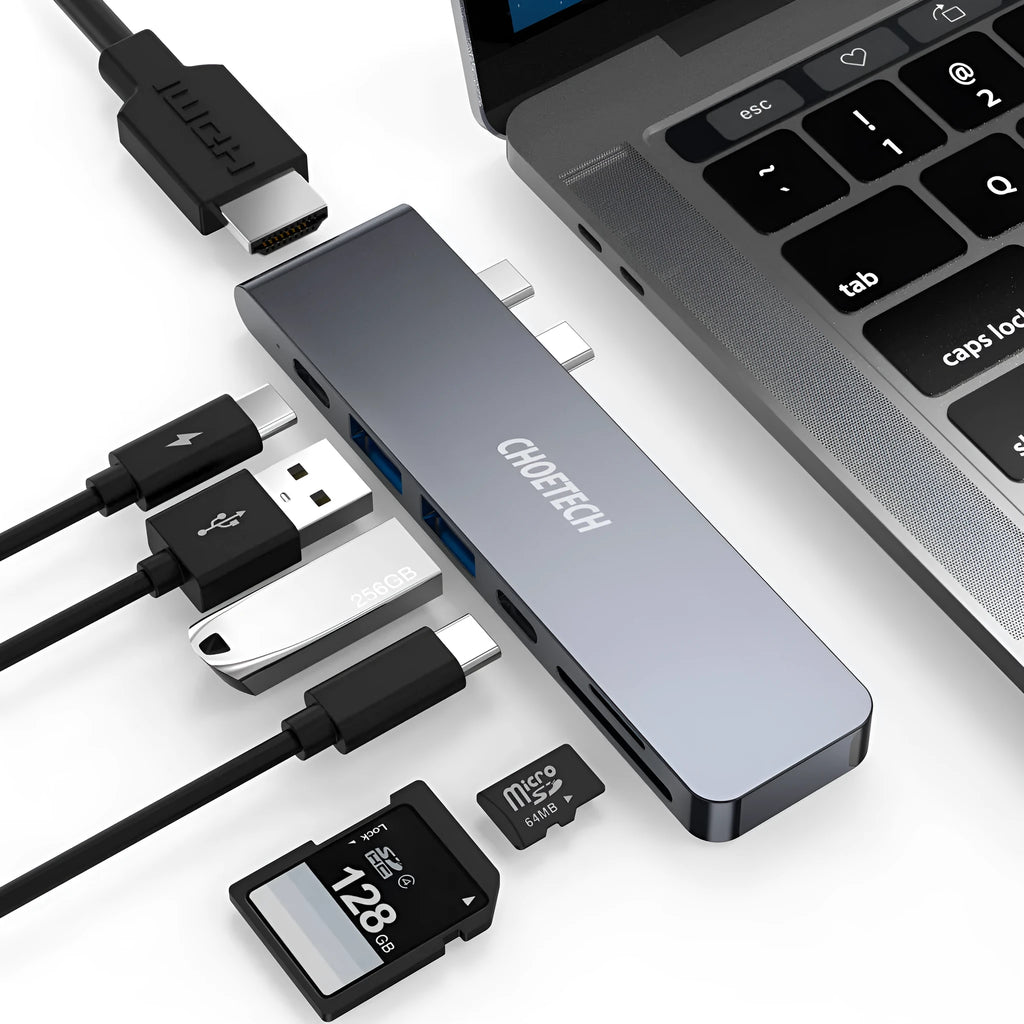 Silver aluminum Type C adapter with SD slot, HDMI port, and USB ports on a white background