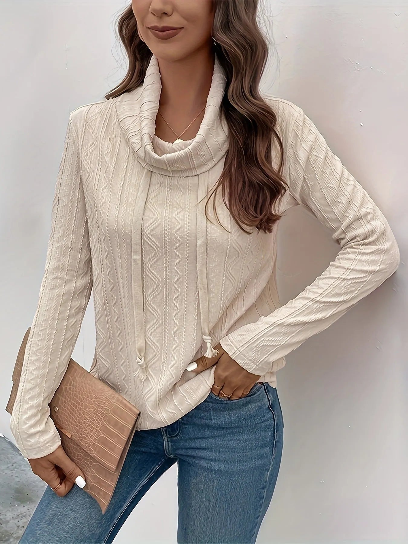 Apricot coloured women's hooded pullover sweater with long sleeves and drawstring adjustment