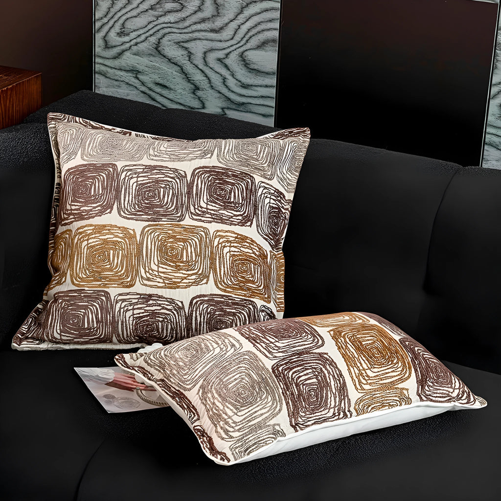 Abstract coil pattern pillow cover in cream and coffee colours with feather velvet texture