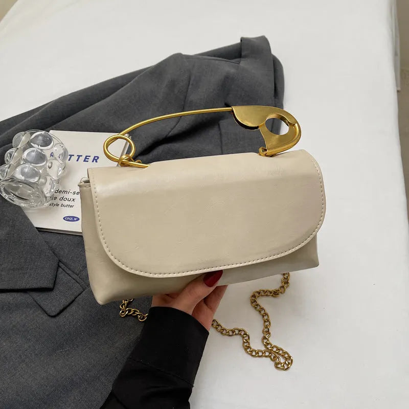 Creative paper clip shoulder handbag in PU leather with sewing thread detail, horizontal square shape