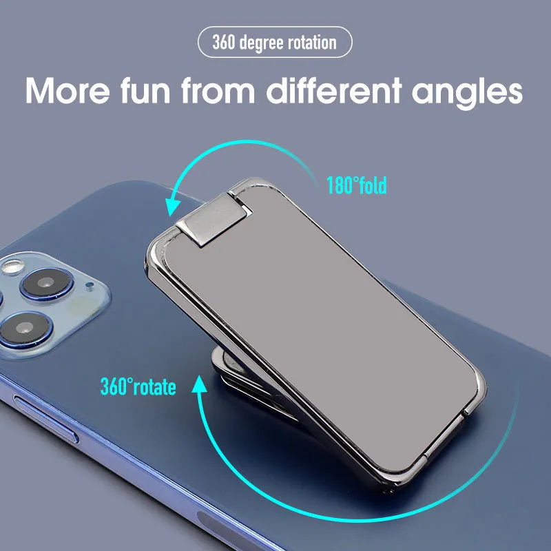 Foldable zinc alloy phone holder ring buckle in silver on a desk propping an iPhone at an angle.