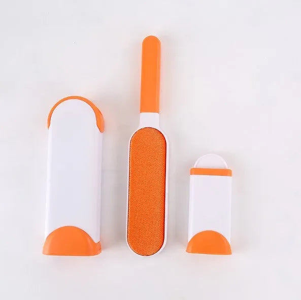 Blue reusable pet hair removal comb with a double-sided sticky brush head and a matching self-cleaning base.