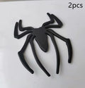 Zinc alloy 3D spider bumper sticker in metallic colours on a car bumper.