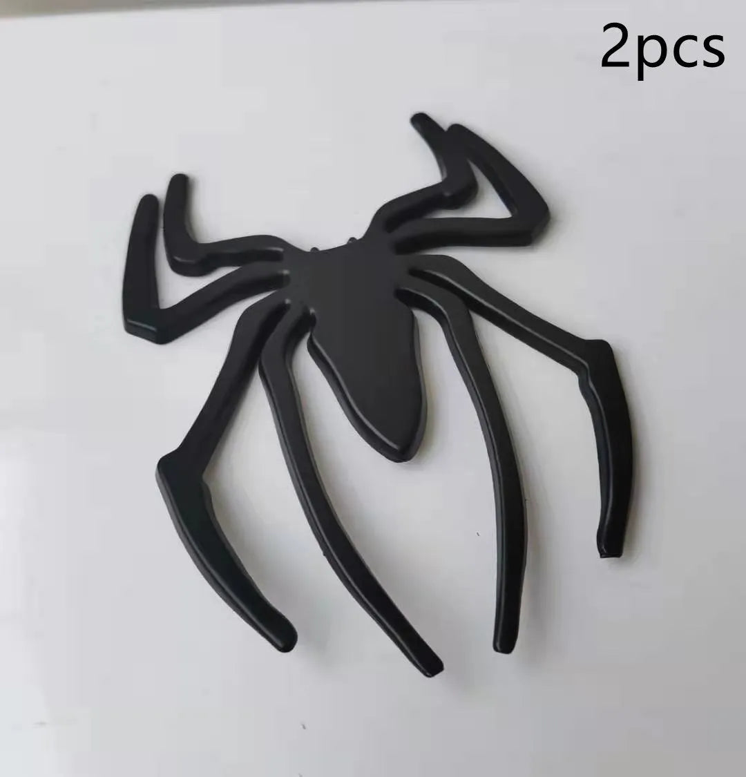 Zinc alloy 3D spider bumper sticker in metallic colours on a car bumper.