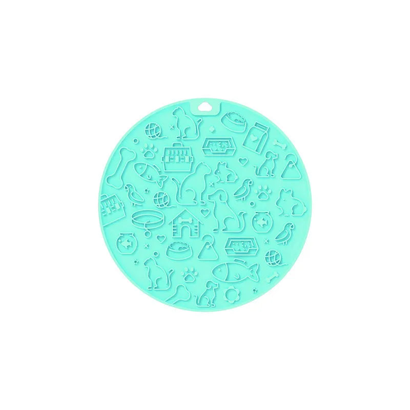 Round blue silicone pet licking mat with suction cups on a flat surface