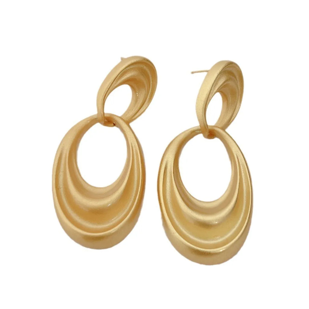 Gold double circle French retro earrings with U-shaped silhouette and quicksand-coloured finish