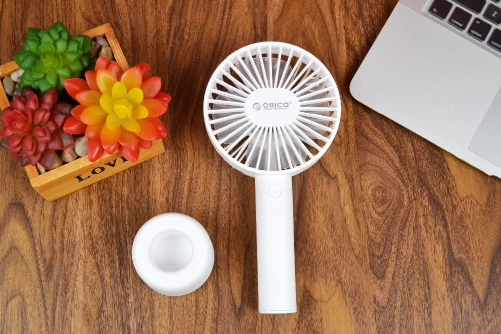 ORICO FH1 white portable USB desk fan with rechargeable battery shown on a desk