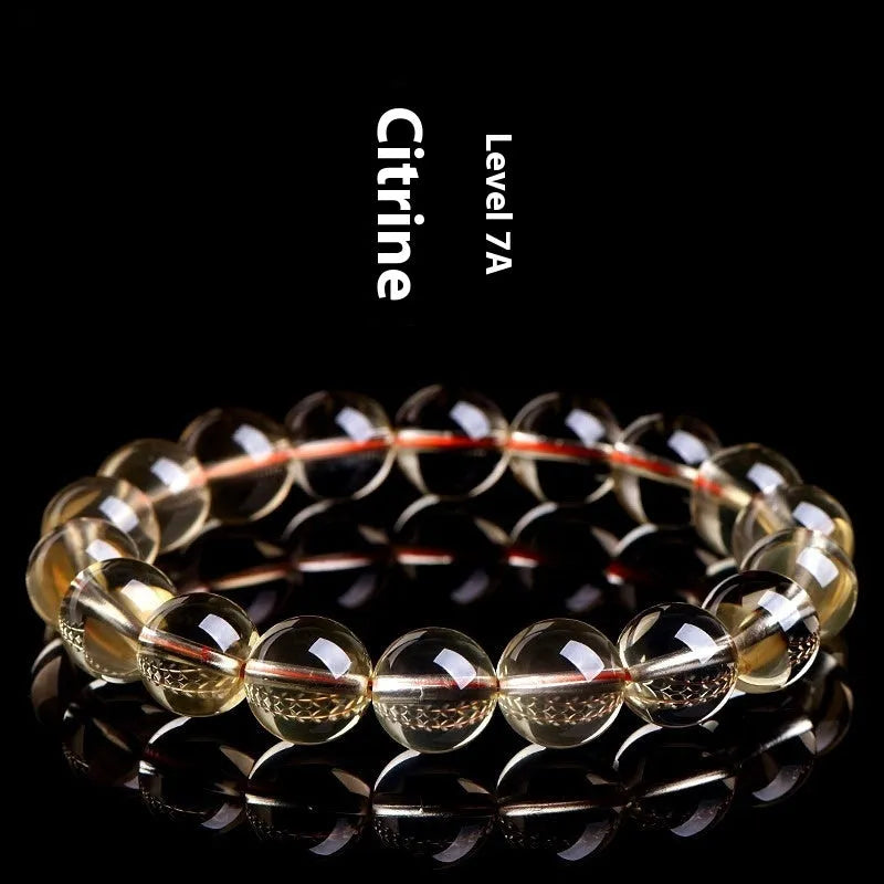 Natural citrine scattered bead bracelet in 7A or 6A grade on a wrist, showing five size options.