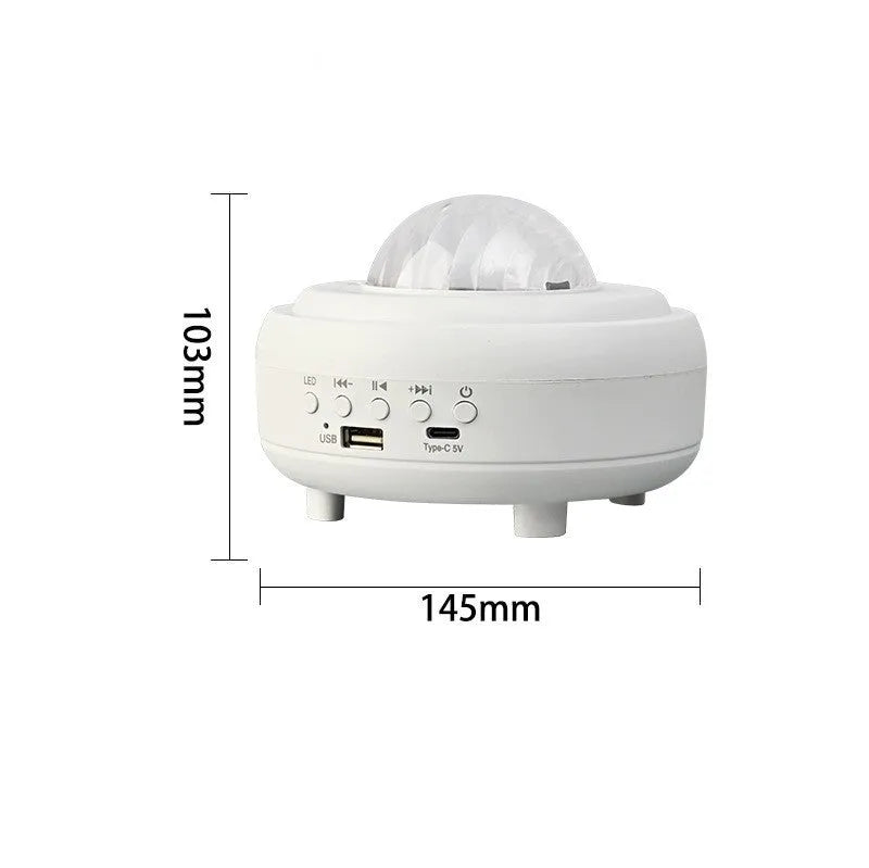 Galaxy star projector night light with 7 light effects and Bluetooth speaker in white rechargeable finish on a bedside table