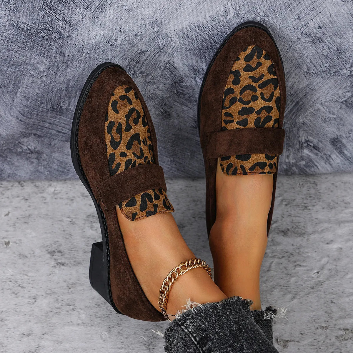 Women's brown leopard print suede slip-on shoes with chunky mid-heel and pointed toe on a white background.
