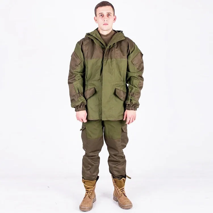Men's special forces tactical jacket and trousers set in olive green, shown in an outdoor setting.