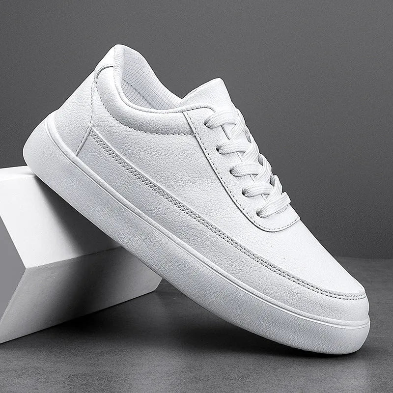 Women's leather flat casual trainers in gold, featuring front lace-up design on a white background.