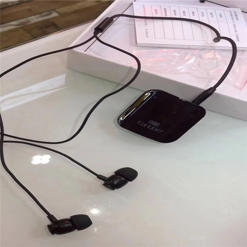 A black Bluetooth lavalier headset worn around the neck with a single earpiece, showing wireless design.